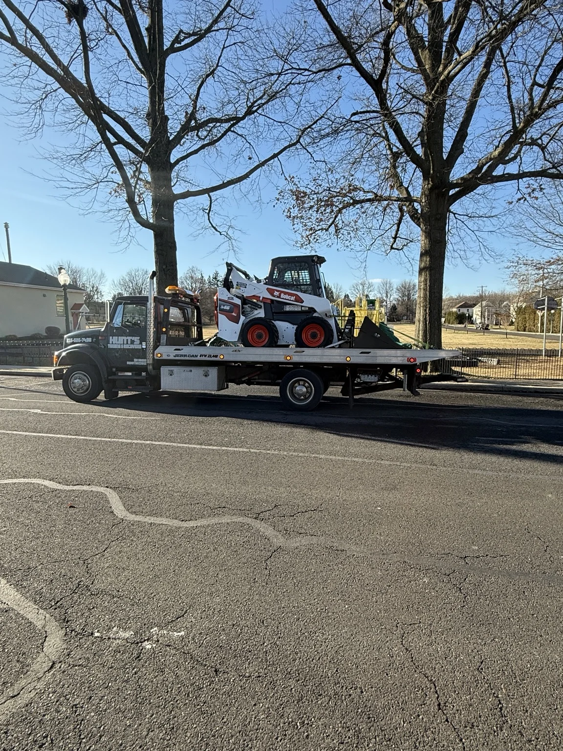 Compact construction equipment secured on the Hunt’s flatbed